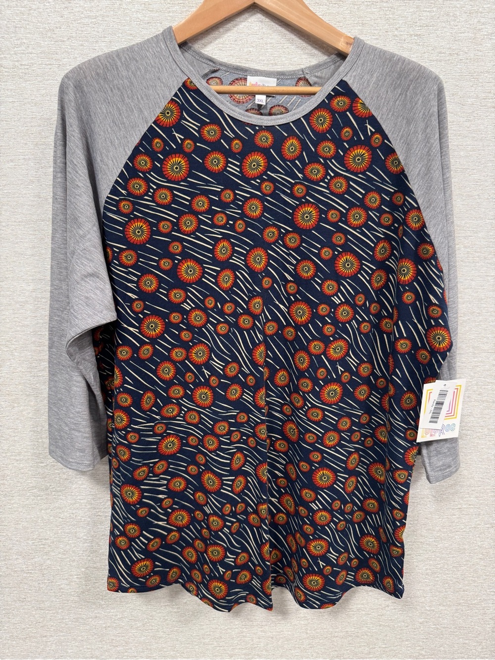 LuLaRoe Navy Floral Burst Raglan Top with Gray Sleeves